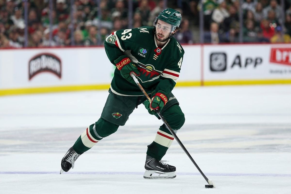 May 11, 2026; Saint Paul, Minnesota, USA; Minnesota Wild defenseman Quinn Hughes (43) skates with the puck against the Colorado Avalanche during the second period in game four of the second round of the 2026 Stanley Cup Playoffs at Grand Casino Arena. Mandatory Credit: Matt Krohn-Imagn Images