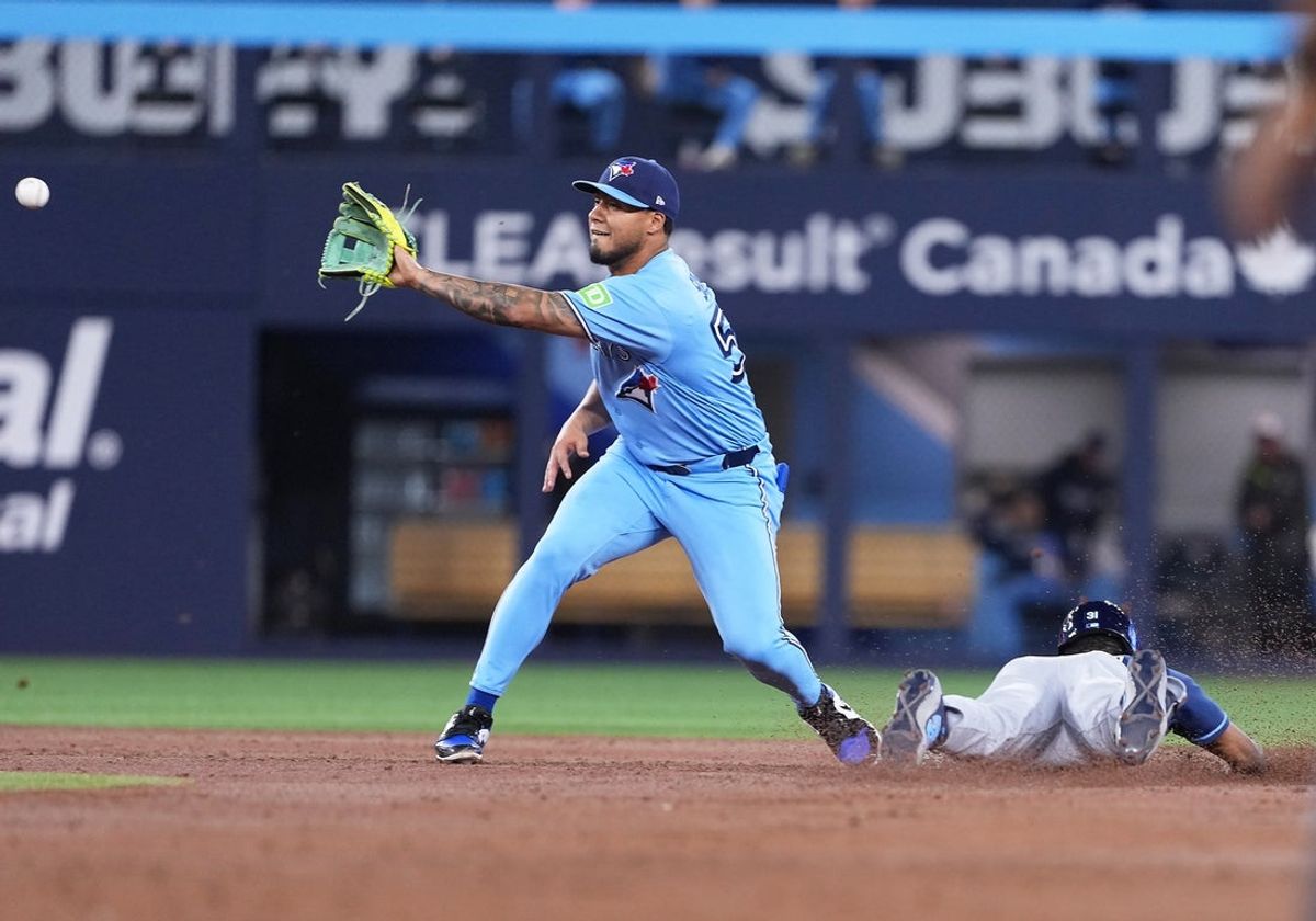 May 12, 2026; Toronto, Ontario, CAN; Tampa Bay Rays center fielder Cedric Mullins (31) steals second base ahead of tag from Toronto Blue Jays second baseman Lenyn Sosa (50) during the third inning at Rogers Centre. Mandatory Credit: Nick Turchiaro-Imagn Images