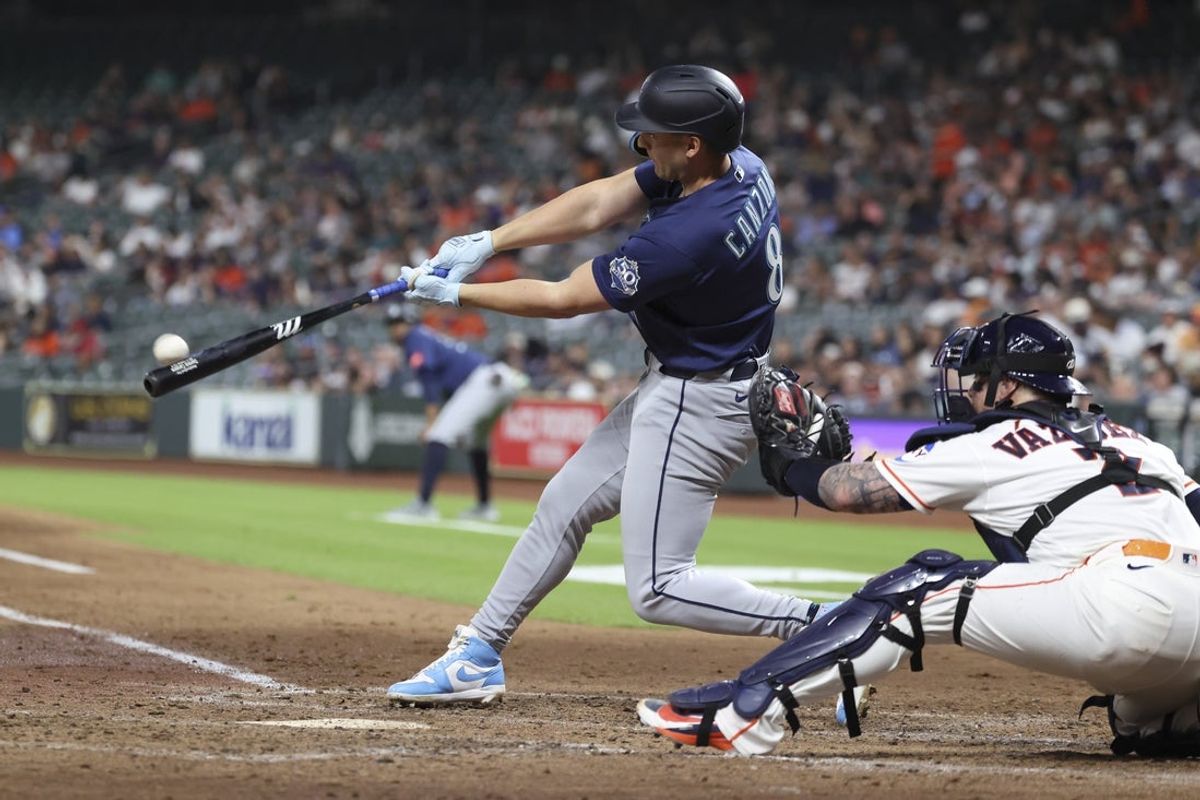 May 12, 2026; Houston, Texas, USA; Seattle Mariners designated hitter Dominic Canzone (8) hits a grand slam home run during the fourth inning against the Houston Astros at Daikin Park. Mandatory Credit: Troy Taormina-Imagn Images