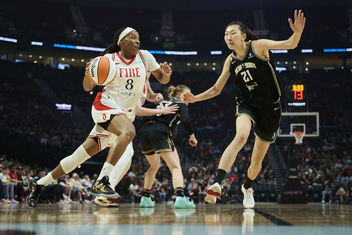 May 12, 2026; Portland, Oregon, USA; Portland Fire guard Kamiah Smalls (8) drives to the basket during the first half against New York Liberty center Han Xu (21) at Moda Center. Mandatory Credit: Troy Wayrynen-Imagn Images