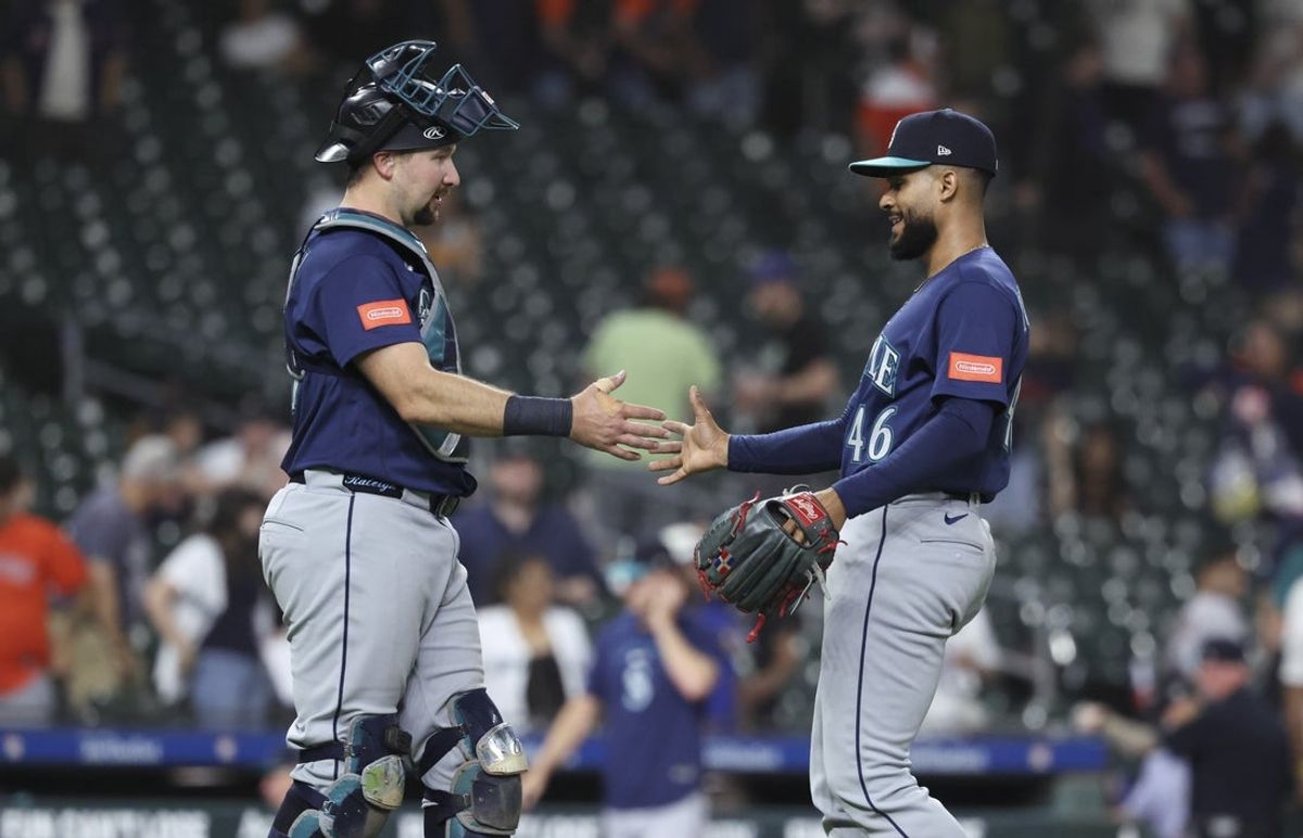 May 12, 2026; Houston, Texas, USA; Seattle Mariners catcher Cal Raleigh (29) and pitcher Domingo Gonzalez (46) celebrate after the game against the Houston Astros at Daikin Park. Mandatory Credit: Troy Taormina-Imagn Images