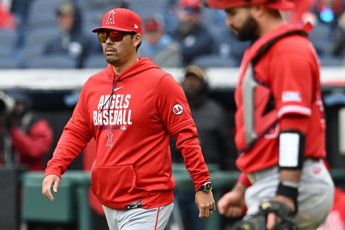 May 13, 2026; Cleveland, Ohio, USA; Los Angeles Angels manager Kurt Suzuki walks to the mound during the sixth inning against the Cleveland Guardians at Progressive Field. Mandatory Credit: Ken Blaze-Imagn Images
