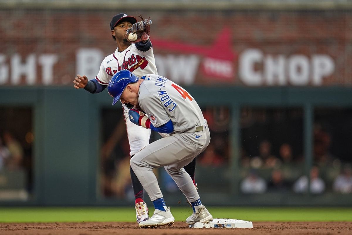 May 13, 2026; Cumberland, Georgia, USA; Atlanta Braves second baseman Ozzie Albies (1) catches a pick off throw over Chicago Cubs center fielder Pete Crow-Armstrong (4) during the third inning at Truist Park. Mandatory Credit: Dale Zanine-Imagn Images
