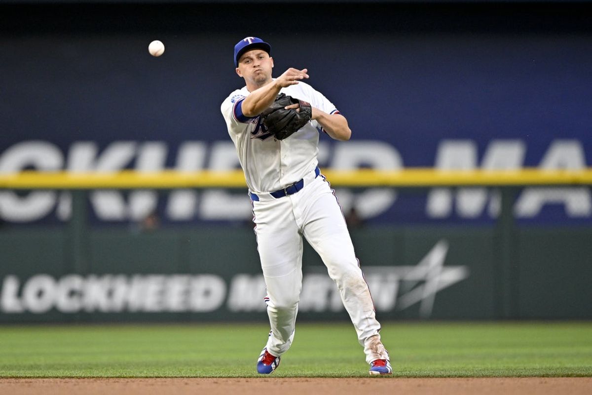 May 13, 2026; Arlington, Texas, USA;  Texas Rangers shortstop Corey Seager (5) throws out Arizona Diamondbacks first baseman Ildemaro Vargas (not pictured) to end the first inning at Globe Life Field. Mandatory Credit: Jerome Miron-Imagn Images