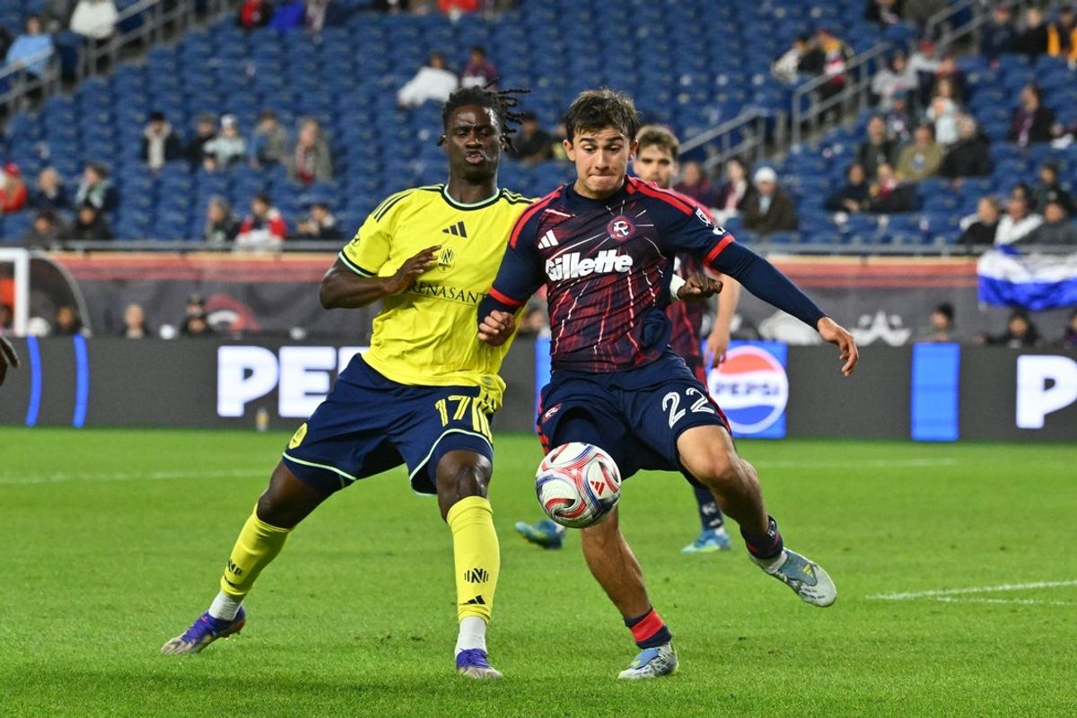 May 13, 2026; Foxborough, Massachusetts, USA; New England Revolution defender Ethan Kohler (22) controls the ball against Nashville SC forward Woobens Pacius (17) during the second half at Gillette Stadium. Mandatory Credit: Eric Canha-Imagn Images