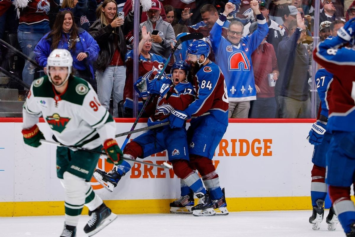 May 13, 2026; Denver, Colorado, USA; Colorado Avalanche center Parker Kelly (17) celebrates his goal with defenseman Brent Burns (84) in the second period against the Minnesota Wild in game five of the second round of the 2026 Stanely Cup Playoffs at Ball Arena. Mandatory Credit: Isaiah J. Downing-Imagn Images