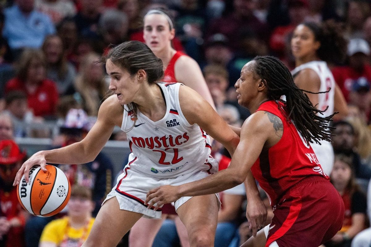 May 15, 2026; Indianapolis, Indiana, USA; Washington Mystics guard Sonia Citron (22) dribbles the ball while Indiana Fever guard Kelsey Mitchell (0) defends in the second half at Gainbridge Fieldhouse. Mandatory Credit: Trevor Ruszkowski-Imagn Images