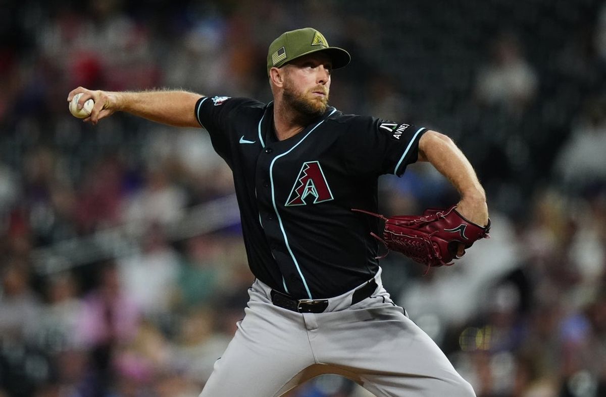 May 15, 2026; Denver, Colorado, USA; Arizona Diamondbacks starting pitcher Merrill Kelly (29) delivers a pitch in the ninth inning against the Colorado Rockies at Coors Field. Mandatory Credit: Ron Chenoy-Imagn Images