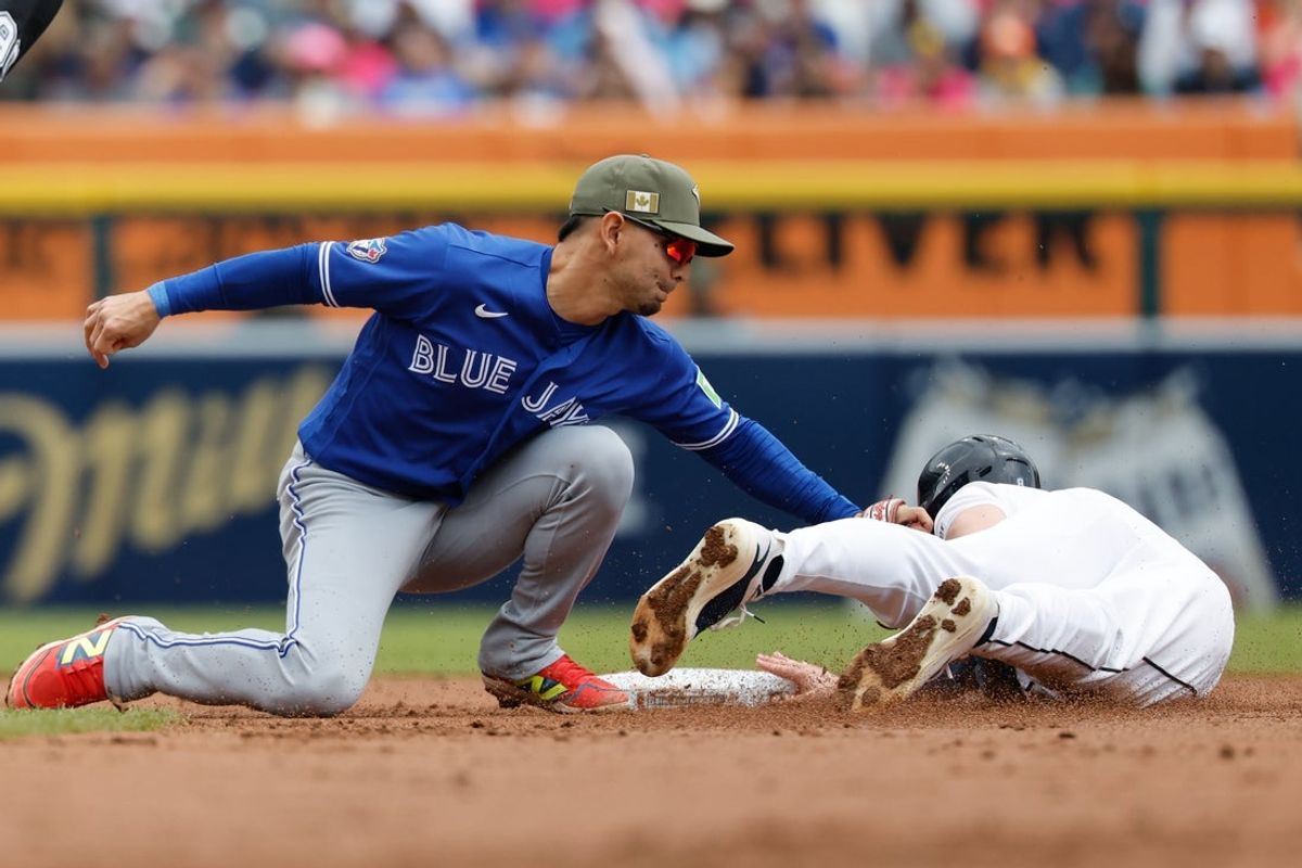 May 16, 2026; Detroit, Michigan, USA; Detroit Tigers center fielder Matt Vierling (8) is tagged out by Toronto Blue Jays shortstop Andres Gimenez (0) trying to steal second in the second inning at Comerica Park. Mandatory Credit: Rick Osentoski-Imagn Images
