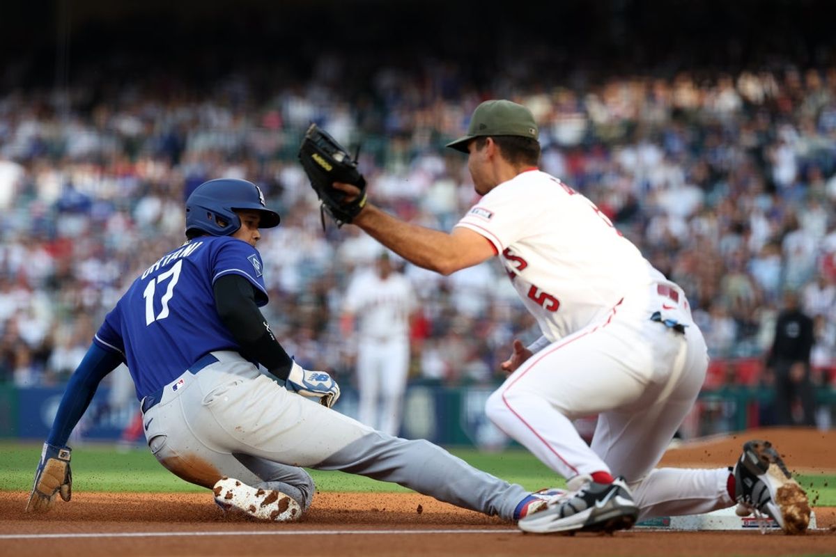 May 16, 2026; Anaheim, California, USA;  Los Angeles Dodgers two-way player Shohei Ohtani (17) slides to third base on a single by shortstop Mookie Betts (not pictured) ahead of a tag from Los Angeles Angels third baseman Vaughn Grissom (5) during the first inning against the Los Angeles Angels at Angel Stadium. Mandatory Credit: Kiyoshi Mio-Imagn Images