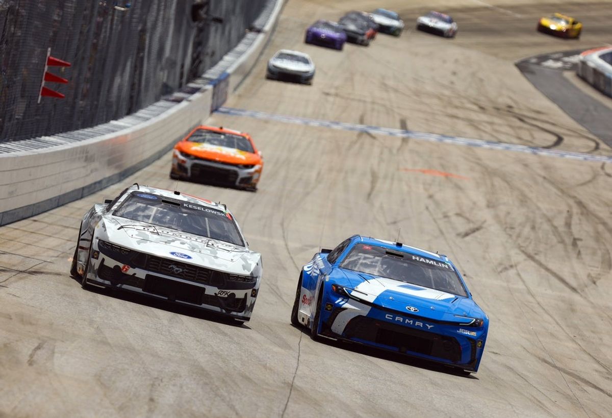 May 17, 2026; Dover, Delaware, USA; NASCAR Cup Series driver Denny Hamlin (11) races to the inside of driver Brad Keselowski (6) during the NASCAR All-Star Race at Dover Motor Speedway. Mandatory Credit: Matthew O'Haren-Imagn Images