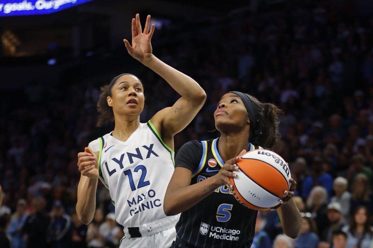 May 17, 2026; Minneapolis, Minnesota, USA; Chicago Sky forward Rickea Jackson (5) works around Minnesota Lynx forward Nia Coffey (12) in the first quarter at Target Center. Mandatory Credit: Bruce Kluckhohn-Imagn Images