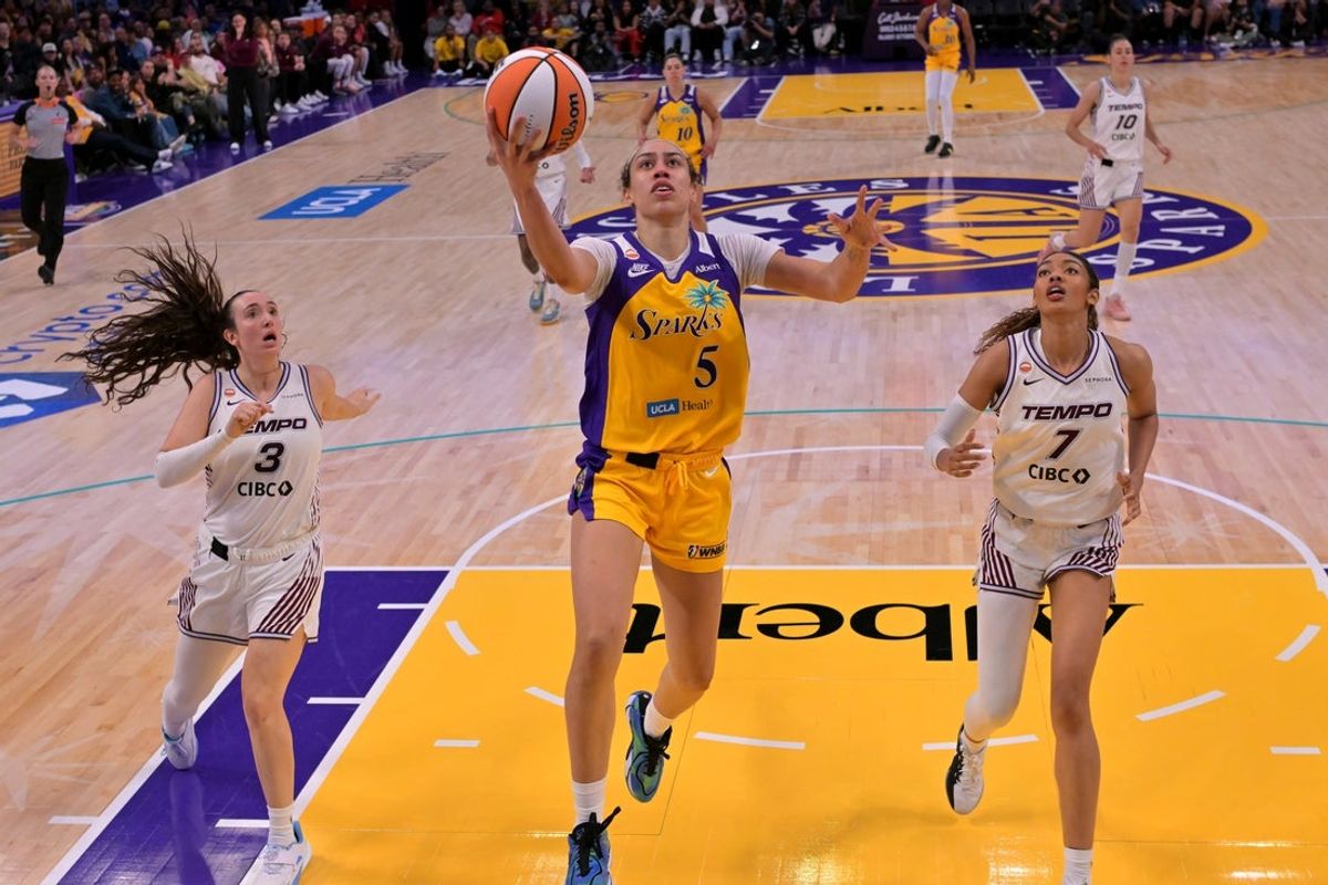 May 17, 2026; Los Angeles, California, USA;  Los Angeles Sparks forward Dearica Hamby (5) drives past Toronto Tempo guard Marina Mabrey (3) and forward Teonni Key (7) in the second half at Crypto.com Arena. Mandatory Credit: Jayne Kamin-Oncea-Imagn Images