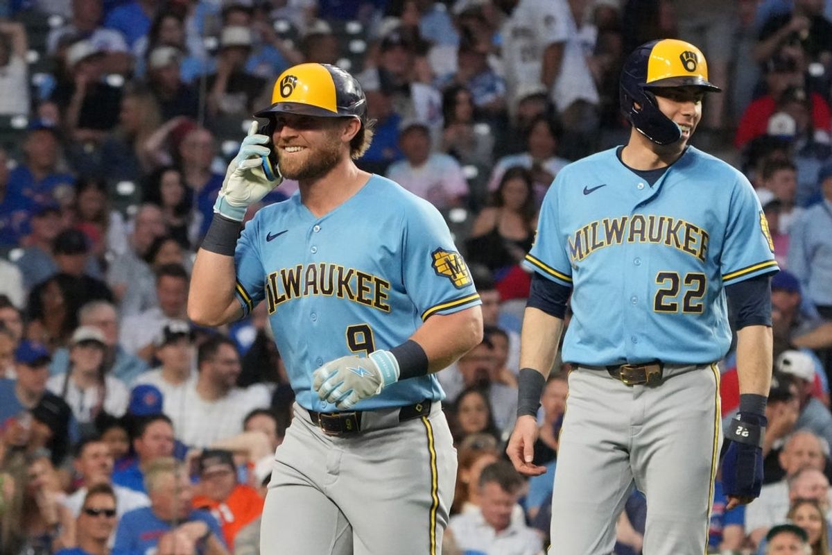 May 18, 2026; Chicago, Illinois, USA; Milwaukee Brewers left fielder Jake Bauers (9) is greeted by designated hitter Christian Yelich (22) after hitting a three-run home run against the Chicago Cubs during the fifth inning at Wrigley Field. Mandatory Credit: David Banks-Imagn Images