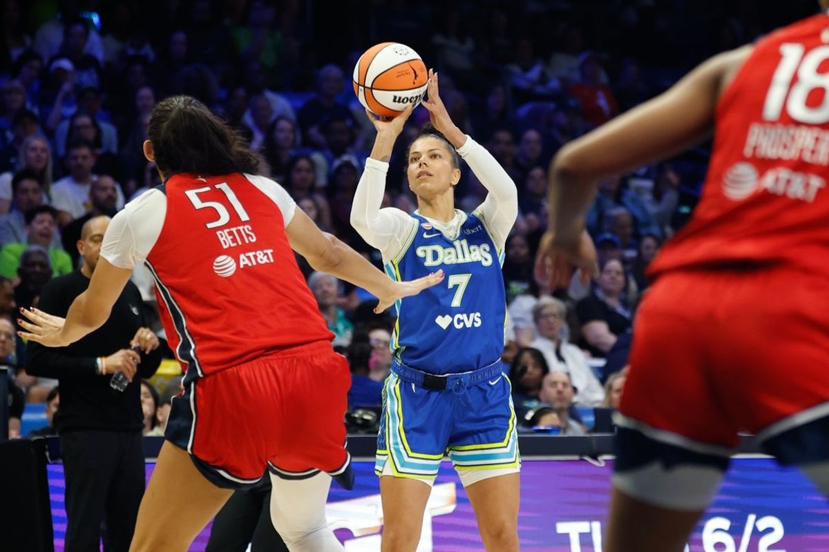 May 18, 2026; Arlington, Texas, USA; Dallas Wings forward Alysha Clark (7) shoots a three-point basket against the Washington Mystics during the first half at College Park Center. Mandatory Credit: Chris Jones-Imagn Images