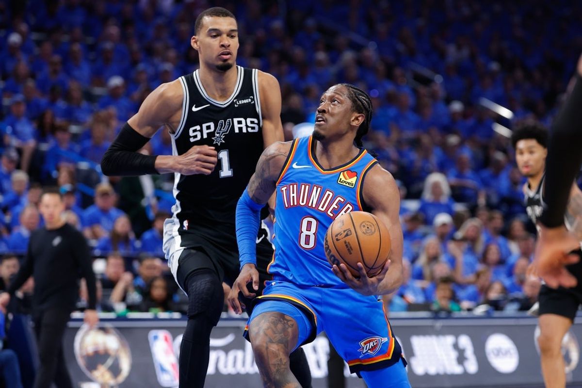 May 18, 2026; Oklahoma City, Oklahoma, USA; Oklahoma City Thunder forward Jalen Williams (8) drives the ball past San Antonio Spurs center Victor Wembanyama (1) in the third quarter during game one of the western conference finals for the 2026 NBA playoffs at Paycom Center. Mandatory Credit: Alonzo Adams-Imagn Images