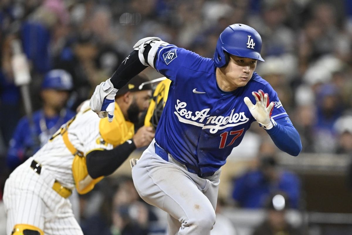May 18, 2026; San Diego, California, USA; Los Angeles Dodgers designated hitter Shohei Ohtani (17) hits a single during the sixth inning against the San Diego Padres at Petco Park. Mandatory Credit: Denis Poroy-Imagn Images