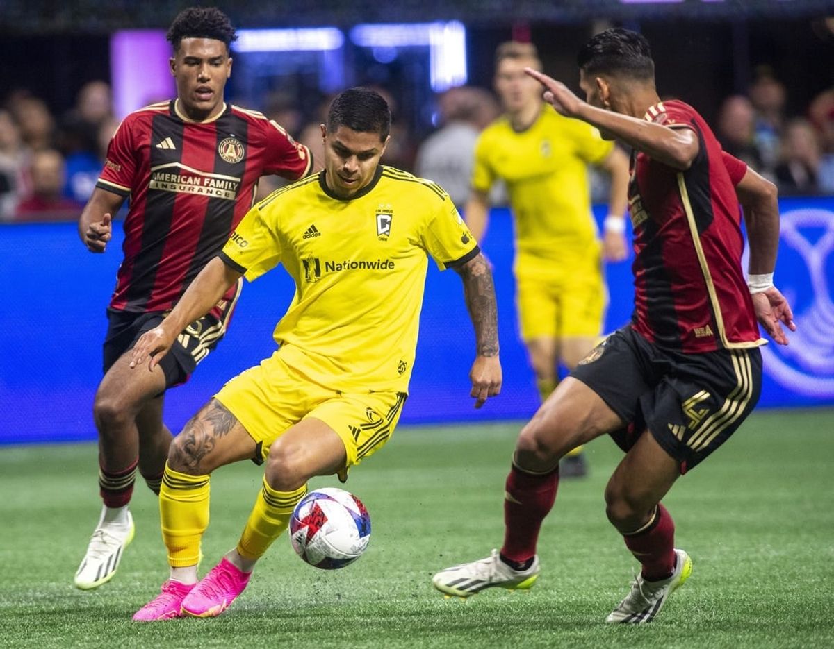 Oct 7, 2023; Atlanta, Georgia, USA;  Columbus Crew forward Cucho Hernandez (9) drives against Atlanta United defender Caleb Wiley (26) and defender Luis Abram (4) at Mercedes-Benz Stadium.