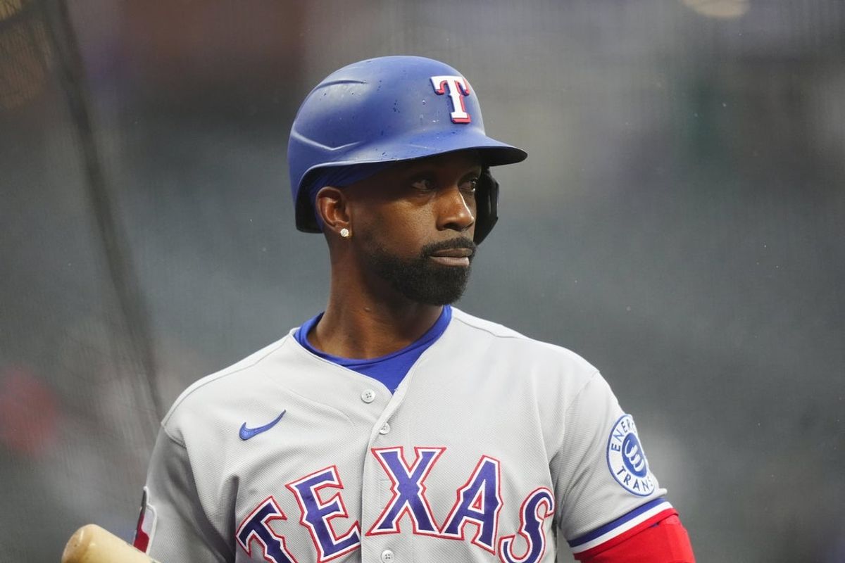 May 19, 2026; Denver, Colorado, USA; Texas Rangers designated hitter Andrew McCutchen (4) on deck in the first inning against the Colorado Rockies at Coors Field. Mandatory Credit: Ron Chenoy-Imagn Images
