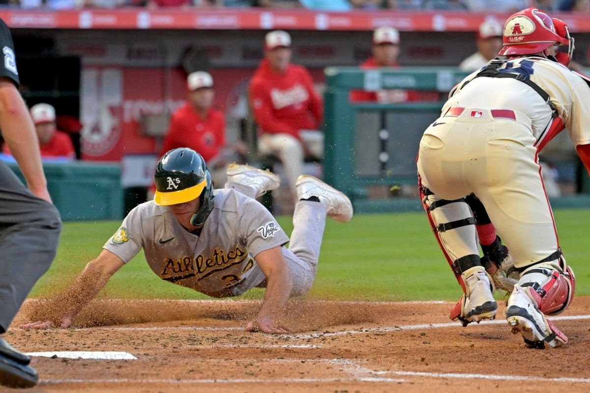 May 19, 2026; Anaheim, California, USA; Athletics designated hitter Brent Rooker (25) hits a RBI single in the third inning against the Los Angeles Angels at Angel Stadium. Mandatory Credit: Jayne Kamin-Oncea-Imagn Images