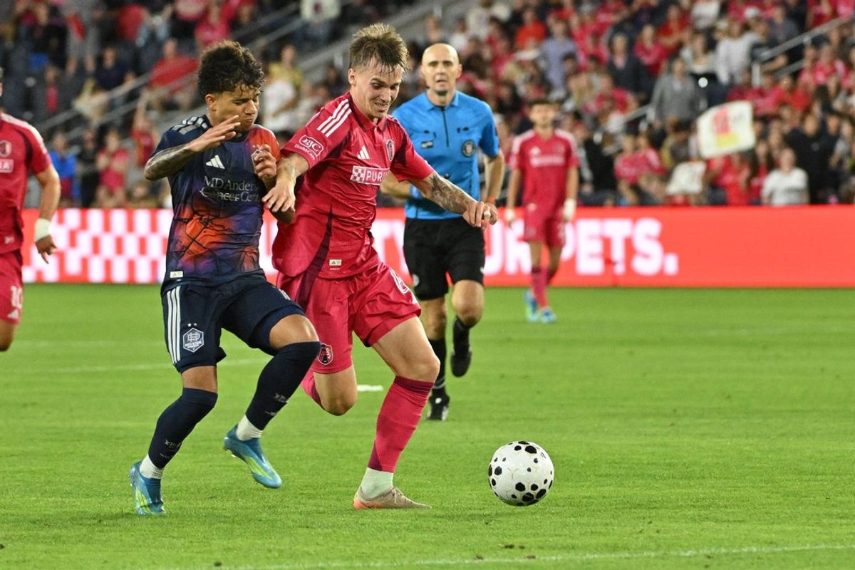 May 19, 2026; St. Louis, MO, USA; Houston Dynamo FC forward Lawrence Ennali (11) battles with St. Louis CITY SC midfielder Conrad Wallem (6) in overtime during the US Open Quarterfinals at Energizer Park. Mandatory Credit: Jeff Le-Imagn Images