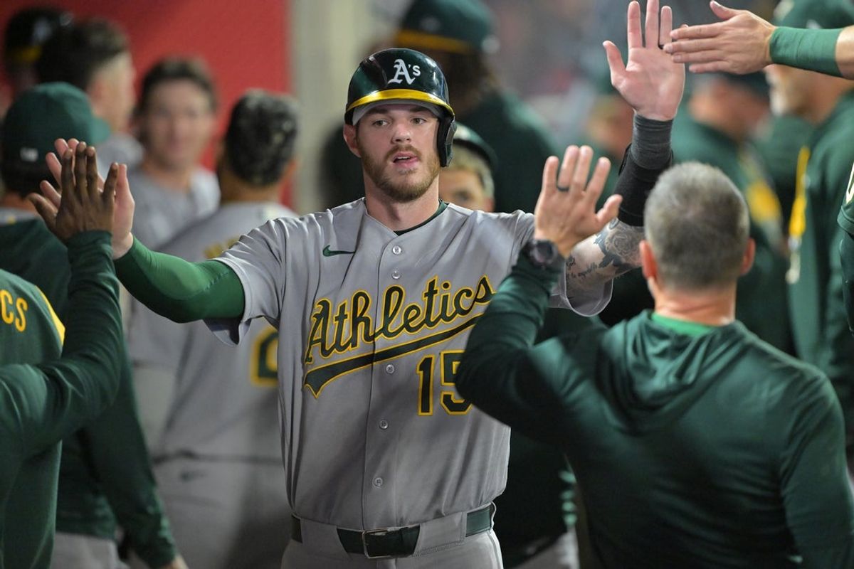 May 19, 2026; Anaheim, California, USA;  Athletics catcher Jonah Heim (15) is greeted in the dugout after scoring on a single by first baseman Nick Kurtz (16) in the sixth inning against the Los Angeles Angels at Angel Stadium. Mandatory Credit: Jayne Kamin-Oncea-Imagn Images