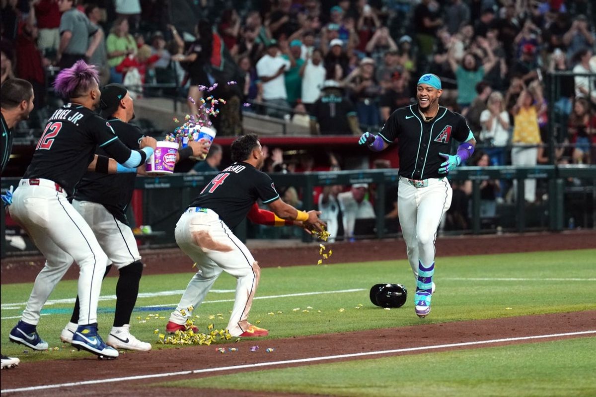 May 19, 2026; Phoenix, Arizona, USA; Arizona Diamondbacks second baseman Ketel Marte (4) is greeted by teammates with bubble gum after hitting a three run walk off home run against the San Francisco Giants during the ninth inning at Chase Field. Mandatory Credit: Joe Camporeale-Imagn Images
