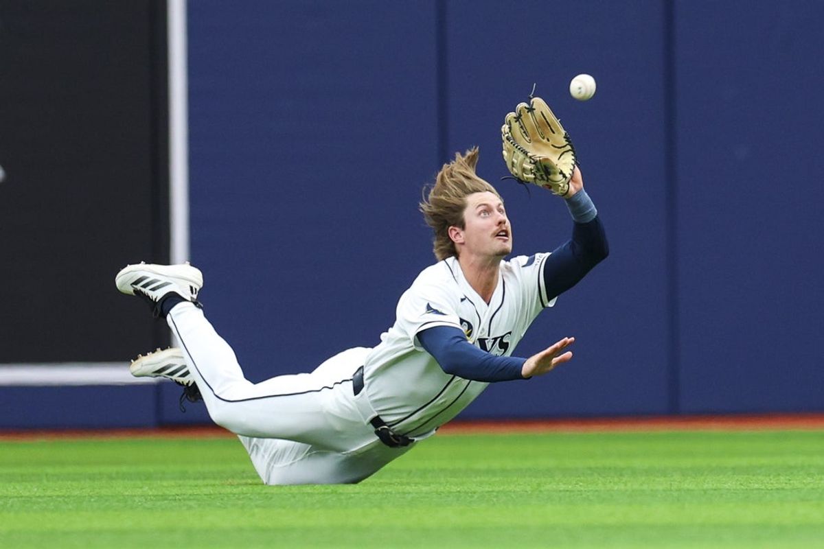 May 20, 2026; St. Petersburg, Florida, USA; Tampa Bay Rays right fielder Jonny DeLuca (21) makes a diving catch against the Baltimore Orioles in the third inning at Tropicana Field. Mandatory Credit: Nathan Ray Seebeck-Imagn Images