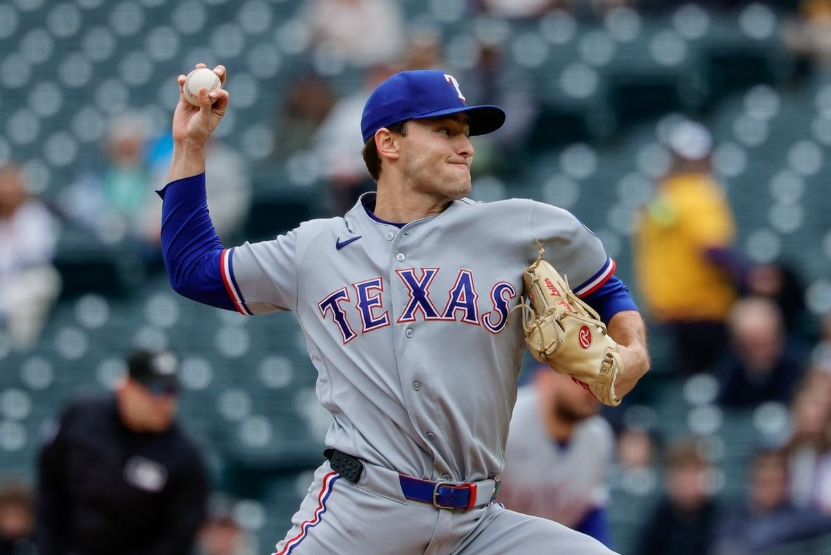 May 20, 2026; Denver, Colorado, USA; Texas Rangers starting pitcher Jack Leiter (22) pitches in the first inning against the Colorado Rockies at Coors Field. Mandatory Credit: Isaiah J. Downing-Imagn Images