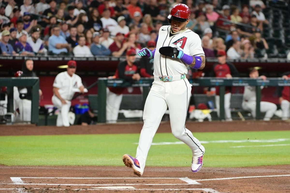 May 20, 2026; Phoenix, Arizona, USA;  Arizona Diamondbacks second baseman Ketel Marte (4) scores in the first inning against the San Francisco Giants at Chase Field. Mandatory Credit: Matt Kartozian-Imagn Images