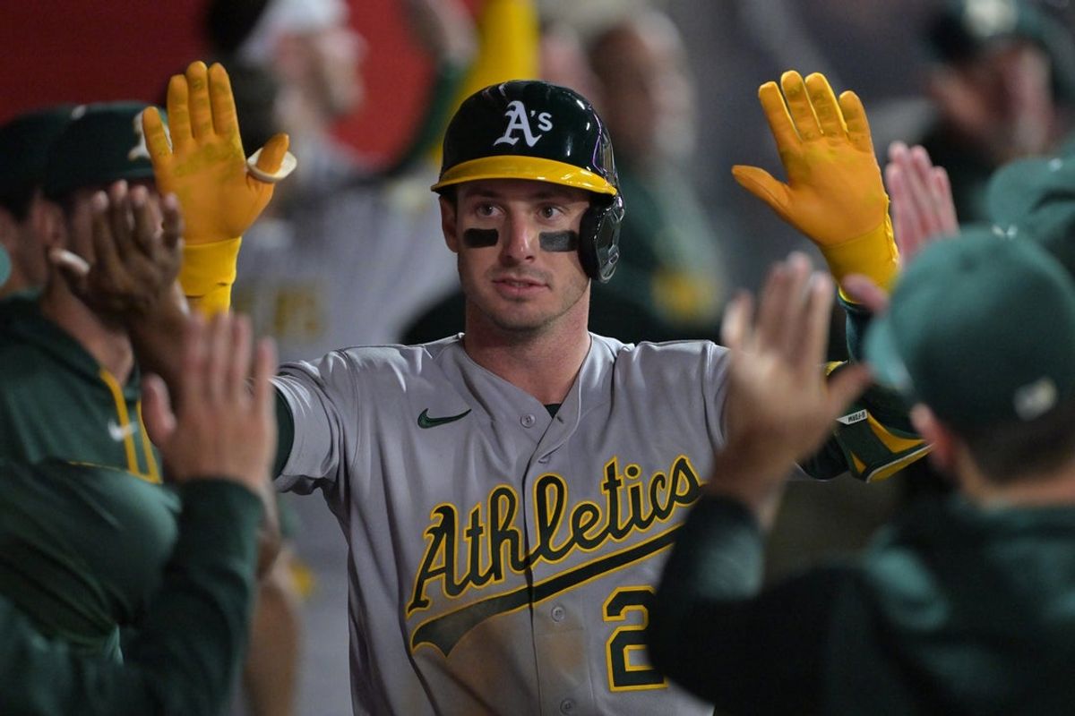 May 19, 2026; Anaheim, California, USA;  Athletics designated hitter Brent Rooker (25) is congratulated in the dugout after a solo home run against the Los Angeles Angels at Angel Stadium. Mandatory Credit: Jayne Kamin-Oncea-Imagn Images
