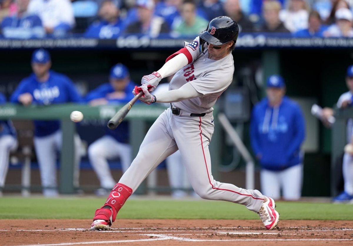 May 20, 2026; Kansas City, Missouri, USA; Boston Red Sox third baseman Nick Sogard (20) hits an RBI single during the second inning against the Kansas City Royals at Kauffman Stadium. Mandatory Credit: Jay Biggerstaff-Imagn Images