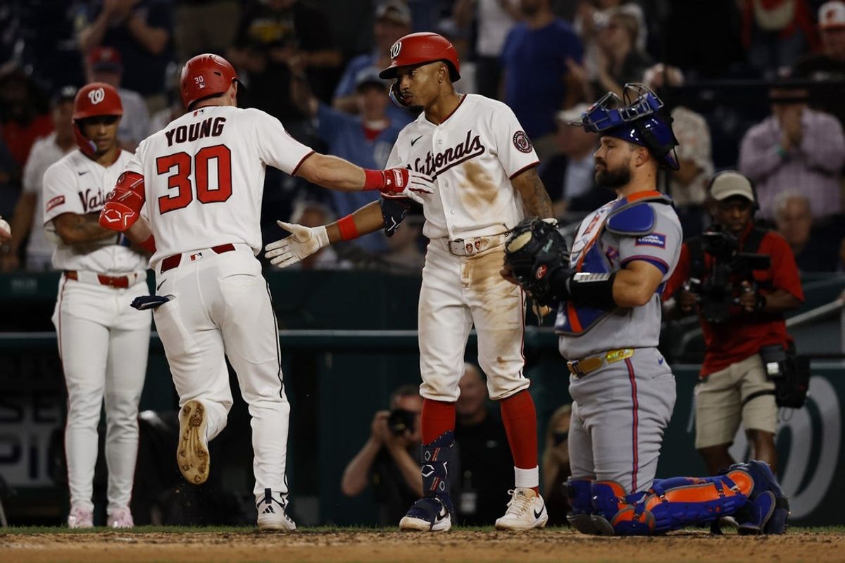 May 20, 2026; Washington, District of Columbia, USA; Washington Nationals center fielder Jacob Young (30) celebrates with Nationals second baseman Nasim Nuñez (26) a two run home run against the New York Mets during the eighth inning at Nationals Park. Mandatory Credit: Geoff Burke-Imagn Images