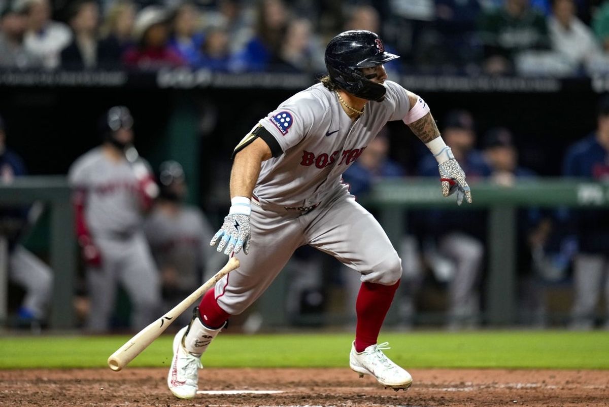 May 20, 2026; Kansas City, Missouri, USA; Boston Red Sox left fielder Jarren Duran (16) hits a triple during the ninth inning against the Kansas City Royals at Kauffman Stadium. Mandatory Credit: Jay Biggerstaff-Imagn Images