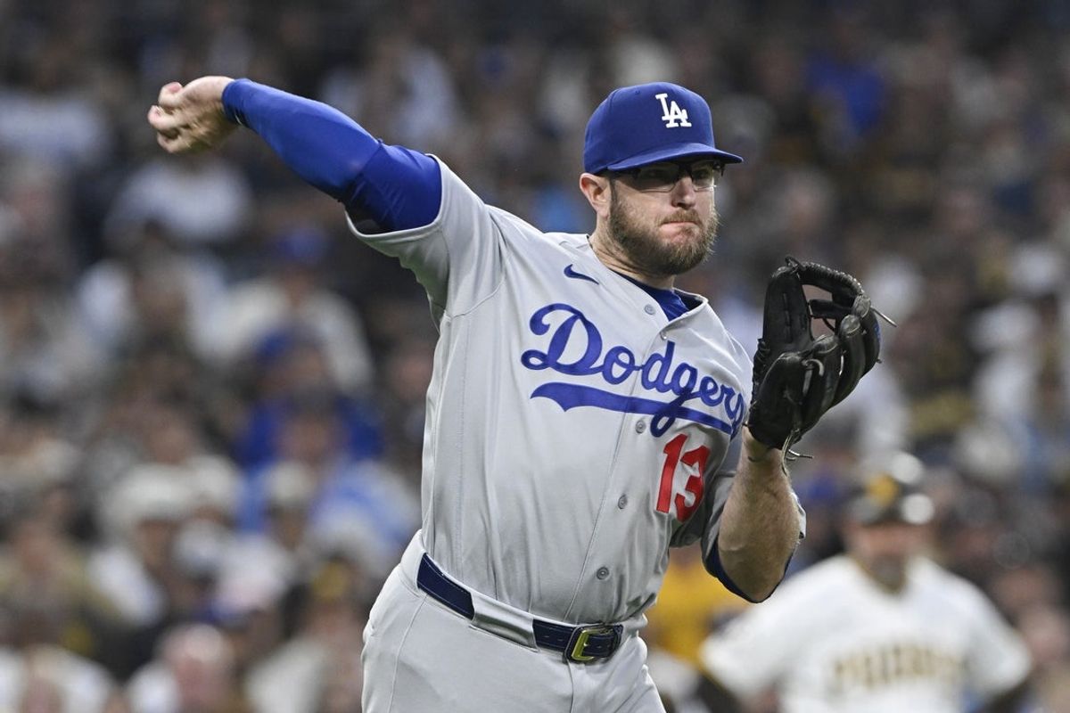 May 20, 2026; San Diego, California, USA; Los Angeles Dodgers third baseman Max Muncy (13) throws out San Diego Padres right fielder Bryce Johnson (not pictured) at first base during the seventh inning at Petco Park. Mandatory Credit: Denis Poroy-Imagn Images