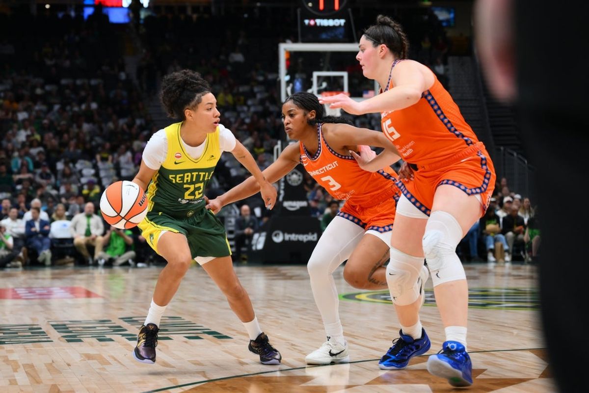 May 20, 2026; Seattle, Washington, USA; Seattle Storm guard Taina Mair (22) dribbles the ball while guarded by Connecticut Sun guard Ashlon Jackson (3) and Connecticut Sun forward Raegan Beers (15) during the first half at Climate Pledge Arena. Mandatory Credit: Steven Bisig-Imagn Images