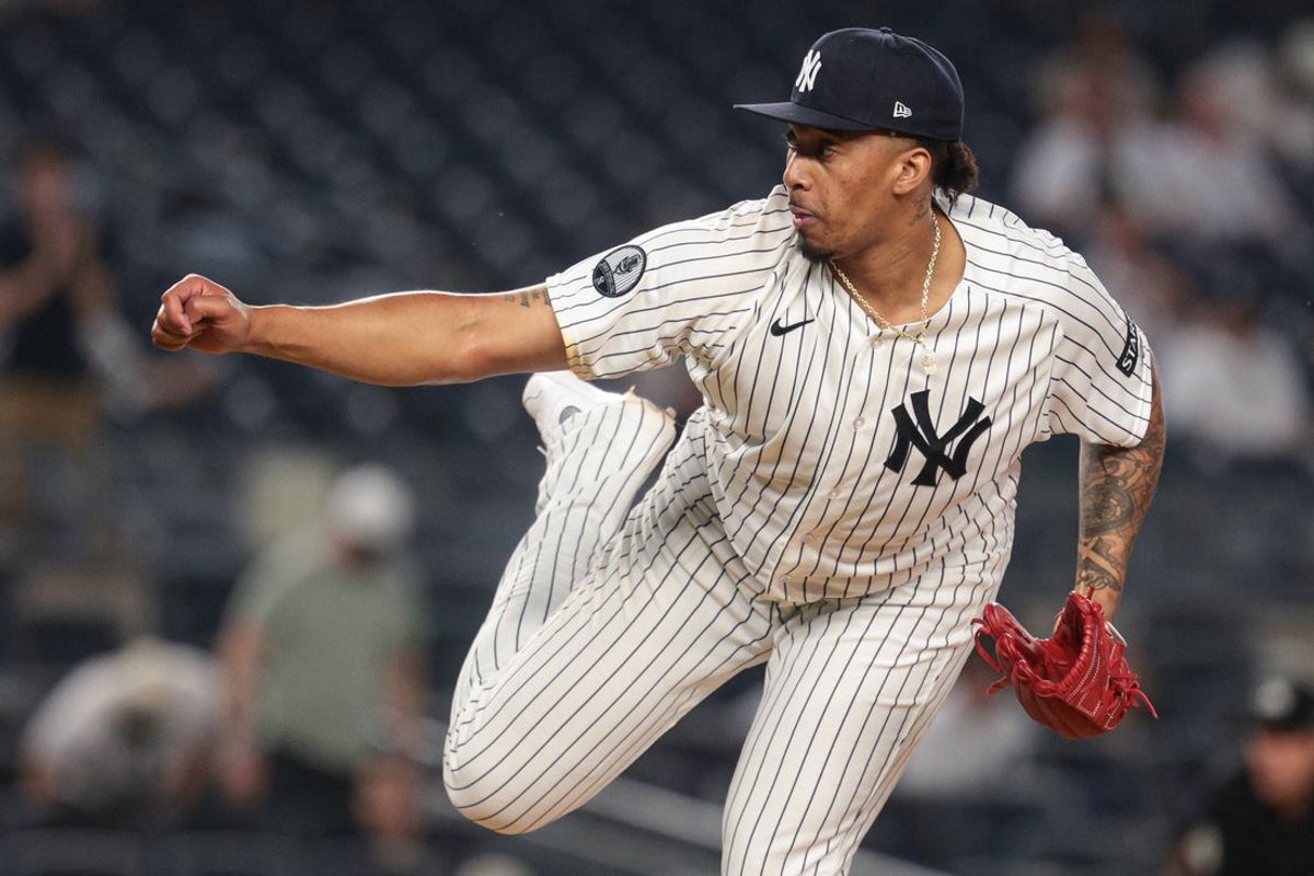 20 de maio de 2026; Bronx, Nova York, EUA; O arremessador do New York Yankees, Yovanny Cruz (96), lança um arremesso contra os Blue Jays na nona entrada no Yankee Stadium. Crédito obrigatório: Vincent Carchietta-Imagn Images