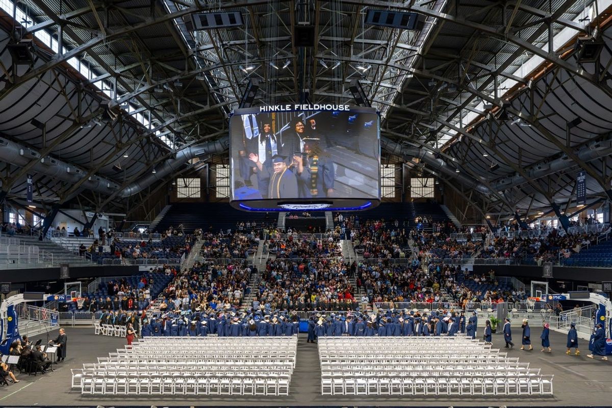 Graduation candidates process into commencement ceremonies for the Shortridge High School Class of 2026, Thursday, May 21, 2026, at Hinkle Fieldhouse.