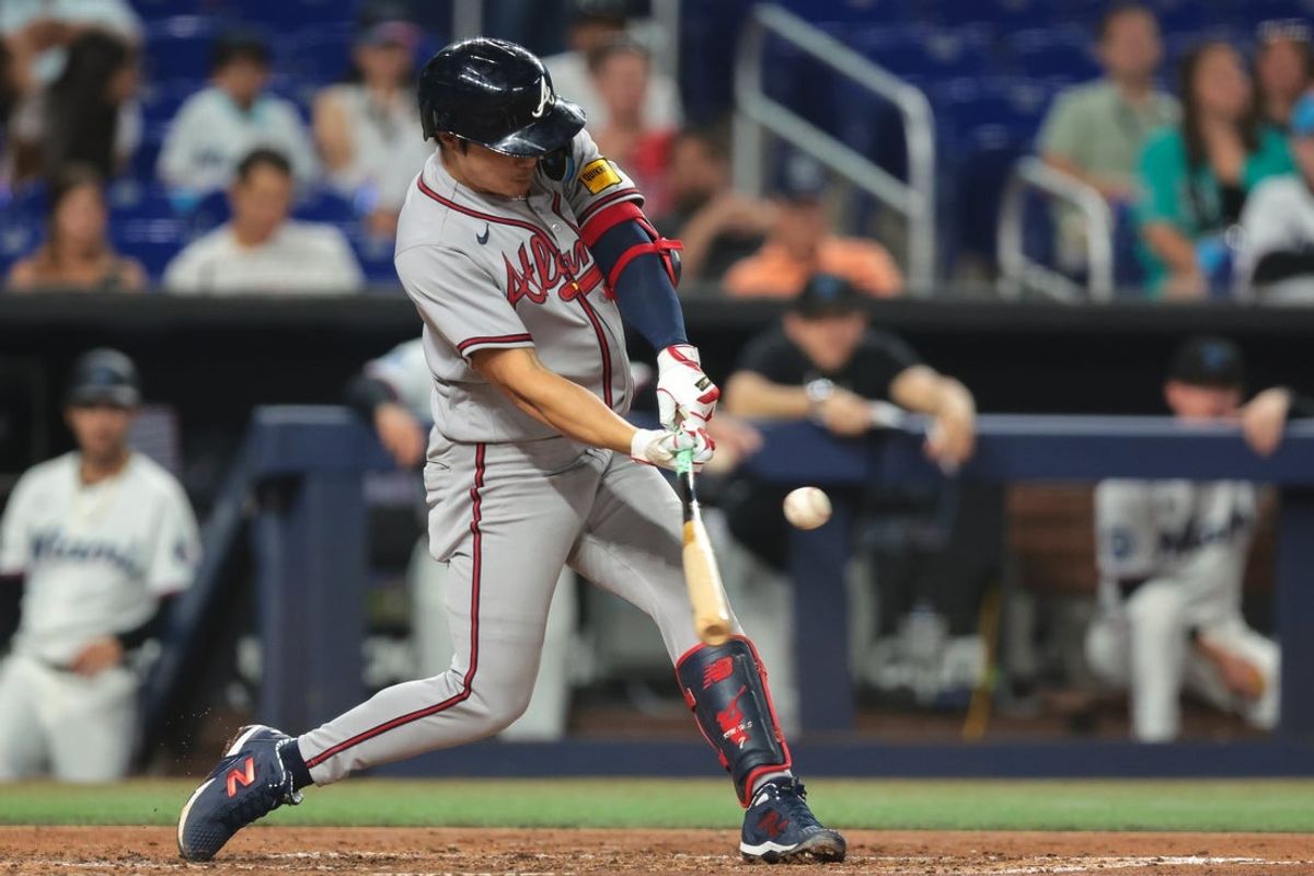 May 21, 2026; Miami, Florida, USA; Atlanta Braves shortstop Ha-Seong Kim (7) hits a single against the Miami Marlins during the fifth inning at loanDepot Park. Mandatory Credit: Sam Navarro-Imagn Images
