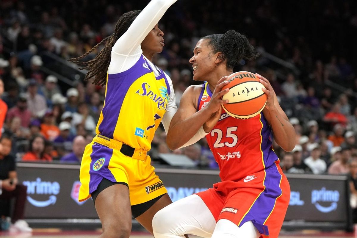 May 21, 2026; Phoenix, Arizona, USA; Phoenix Mercury forward Alyssa Thomas (25) drives against Los Angeles Sparks guard Ariel Atkins (7) in the second half at Mortgage Matchup Center. Mandatory Credit: Rick Scuteri-Imagn Images