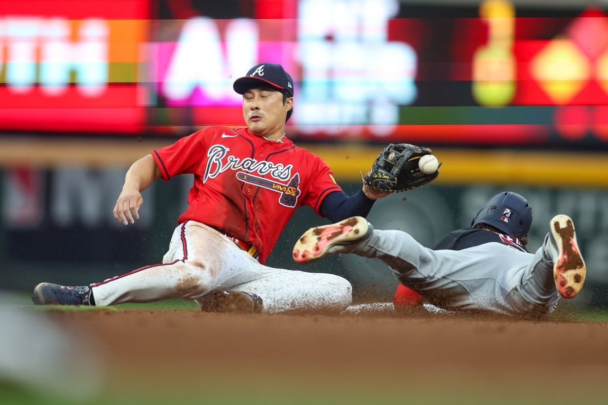 May 22, 2026; Atlanta, Georgia, USA; Washington Nationals right fielder Dylan Crews (3) steals second base past Atlanta Braves shortstop Ha-Seong Kim (7) in the fourth inning at Truist Park. Mandatory Credit: Brett Davis-Imagn Images