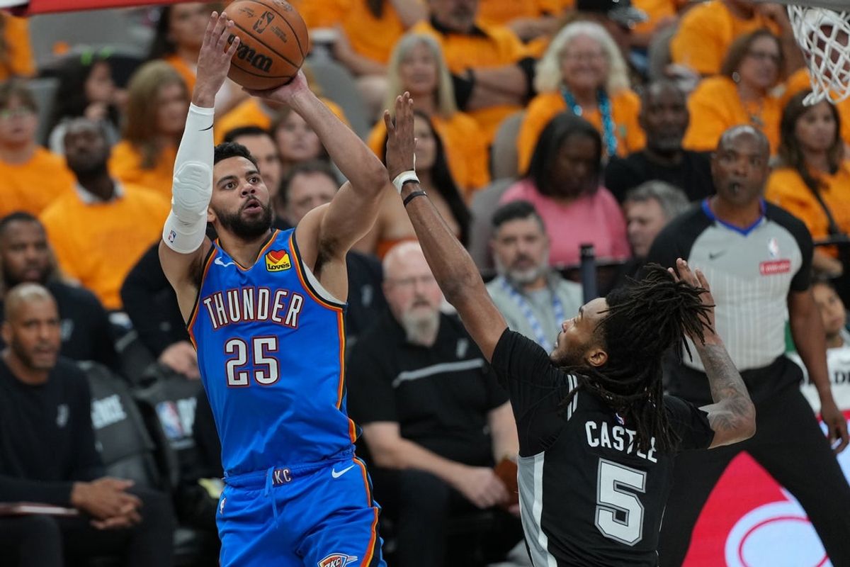 May 22, 2026; San Antonio, Texas, USA; Oklahoma City Thunder guard Ajay Mitchell (25) shoots the ball over San Antonio Spurs guard Stephon Castle (5) in the first half during game three of the western conference finals for the 2026 NBA playoffs at Frost Bank Center. Mandatory Credit: Daniel Dunn-Imagn Images