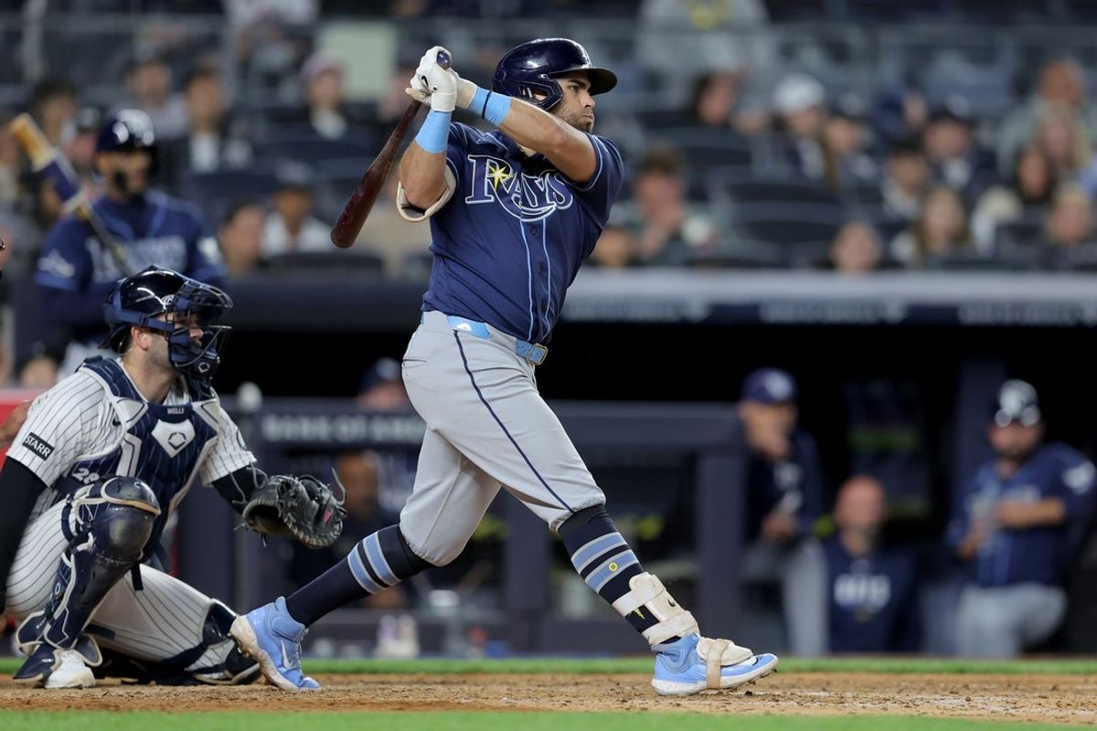 May 22, 2026; Bronx, New York, USA; Tampa Bay Rays first baseman Jonathan Aranda (8) follows through on an RBI double against the New York Yankees during the eighth inning at Yankee Stadium. Mandatory Credit: Brad Penner-Imagn Images