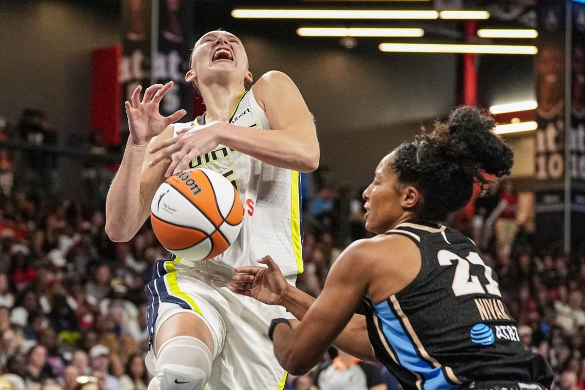 May 22, 2026; College Park, Georgia, USA; Dallas Wings guard Paige Bueckers (5) drives with the ball against Atlanta Dream guard Indya Nivar (21) at Gateway Center Arena in College Park. Mandatory Credit: Dale Zanine-Imagn Images