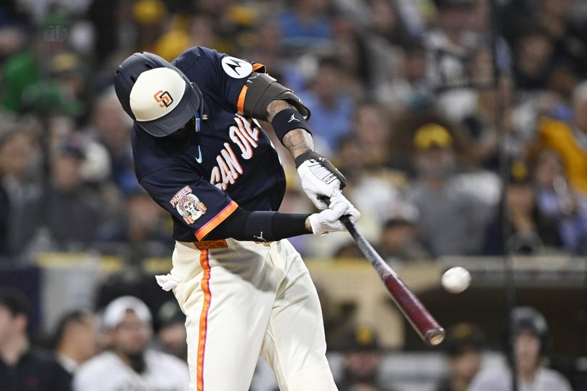 May 22, 2026; San Diego, California, USA; San Diego Padres right fielder Nick Castellanos (21) hits a solo home run during the fifth inning against the Athletics at Petco Park. Mandatory Credit: Denis Poroy-Imagn Images