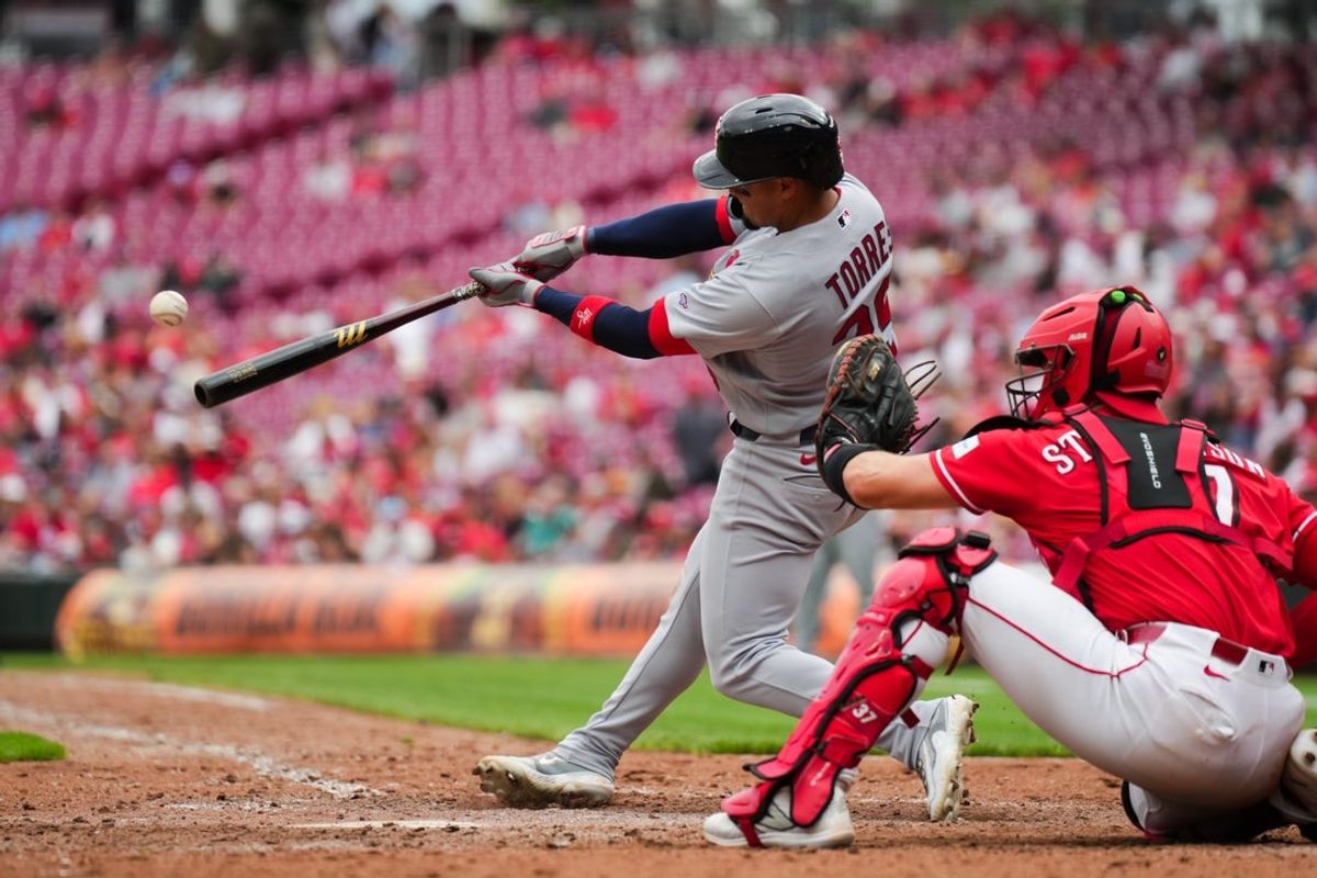 May 23, 2026; Cincinnati, Ohio, USA;  St. Louis Cardinals outfielder Bryan Torres (39) hits a two-run home run against the Cincinnati Reds in the ninth inning at Great American Ball Park. Mandatory Credit: Aaron Doster-Imagn Images