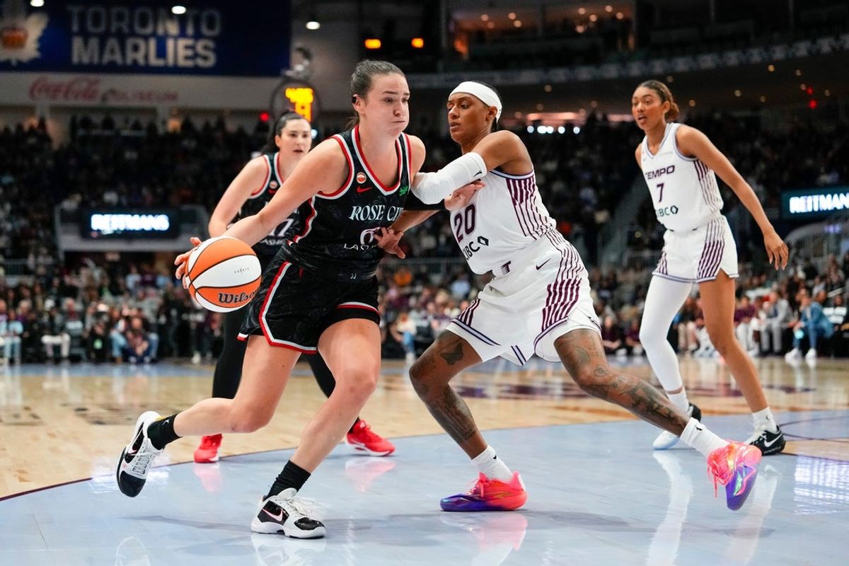 May 23, 2026; Toronto, Ontario, CAN;  Portland Fire forward Bridget Carleton (6) dribbles against Toronto Tempo guard Brittney Sykes (20) during the first half at Coca-Cola Coliseum. Mandatory Credit: Kevin Sousa-Imagn Images