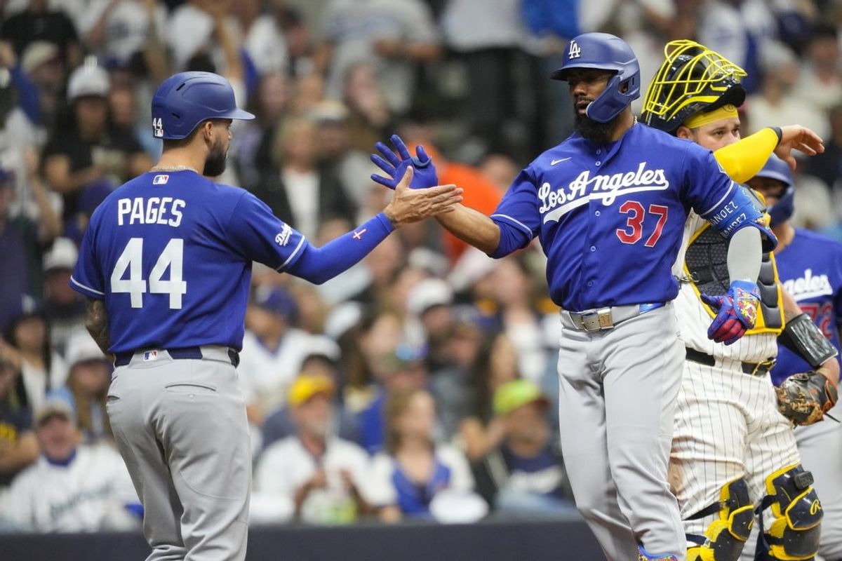 May 23, 2026; Milwaukee, Wisconsin, USA;  Los Angeles Dodgers left fielder Teoscar Hernandez (37) celebrates with center fielder Andy Pages (44) after hitting a home run during the fourth inning against the Milwaukee Brewers at American Family Field. Mandatory Credit: Jeff Hanisch-Imagn Images