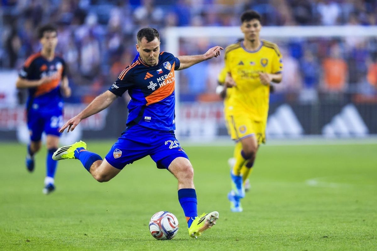 May 23, 2026; Cincinnati, Ohio, USA; FC Cincinnati midfielder Pavel Bucha (20) kicks the ball against Orlando City SC in the first half at TQL Stadium. Mandatory Credit: Katie Stratman-Imagn Images