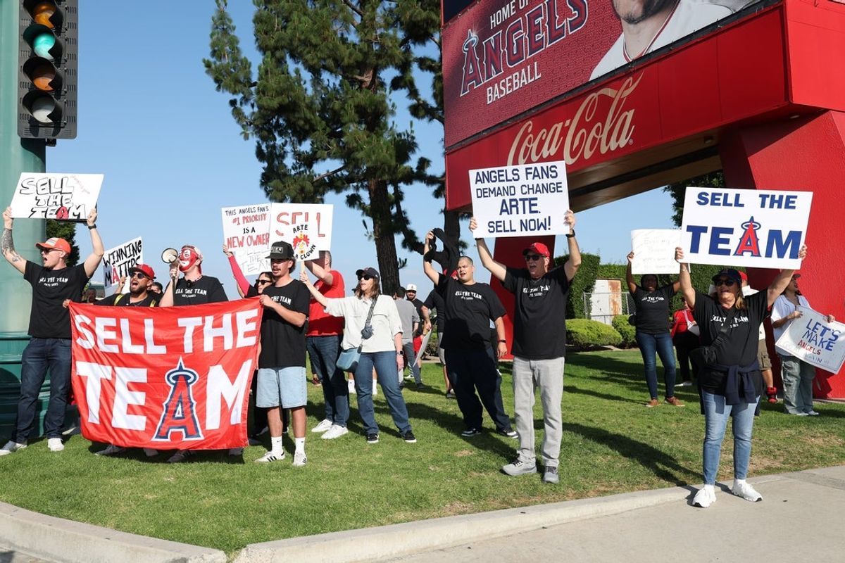 May 23, 2026; Anaheim, California, USA;  Los Angeles Angels fans gather outside Angel Stadium before the game between the Los Angeles Angels and the Texas Rangers to protest the Angels team owner Arte Moreno. Mandatory Credit: Kiyoshi Mio-Imagn Images